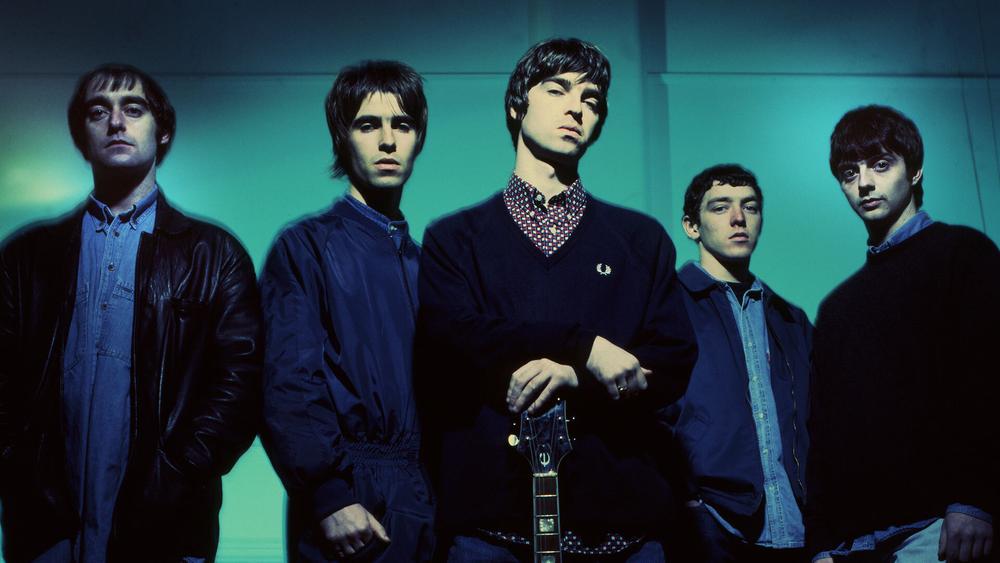Оригинальный состав Oasis (Пол Артурс, Лиам Галлахер, Ноэл Галлахер, Тони Маккэрролл, Пол Макгиган), 1993 год